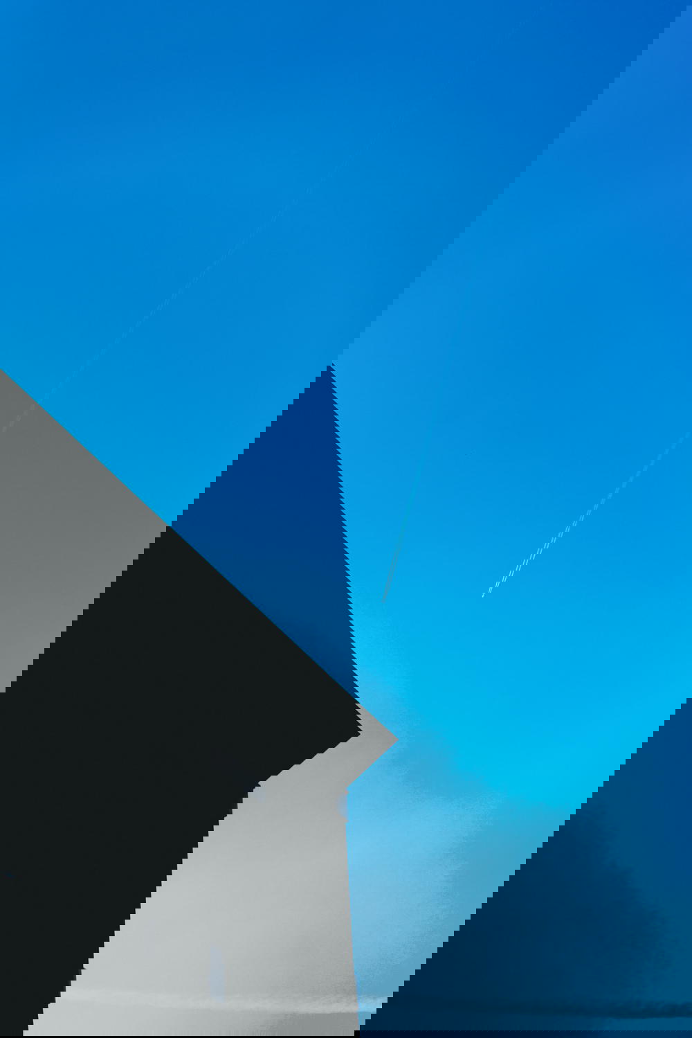 The architecture in Rotterdam, The Netherlands showcases a beautiful blue sky.