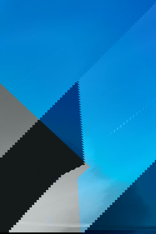 The architecture in Rotterdam, The Netherlands showcases a beautiful blue sky.