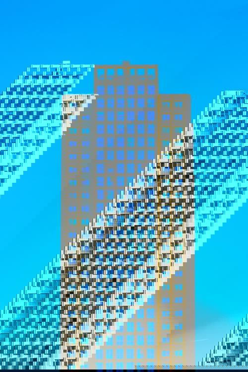 A towering architectural masterpiece in Rotterdam, The Netherlands adorned with countless windows.