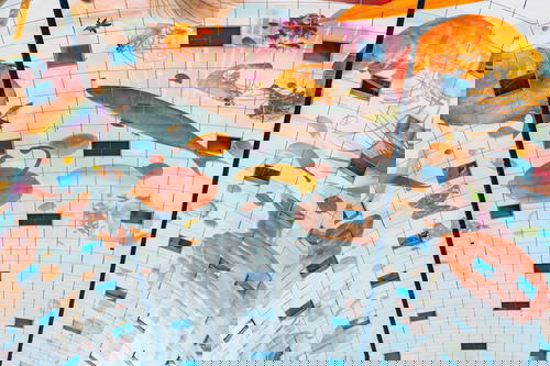 The architecture of a building in Rotterdam, The Netherlands, showcases a ceiling mural featuring fish.