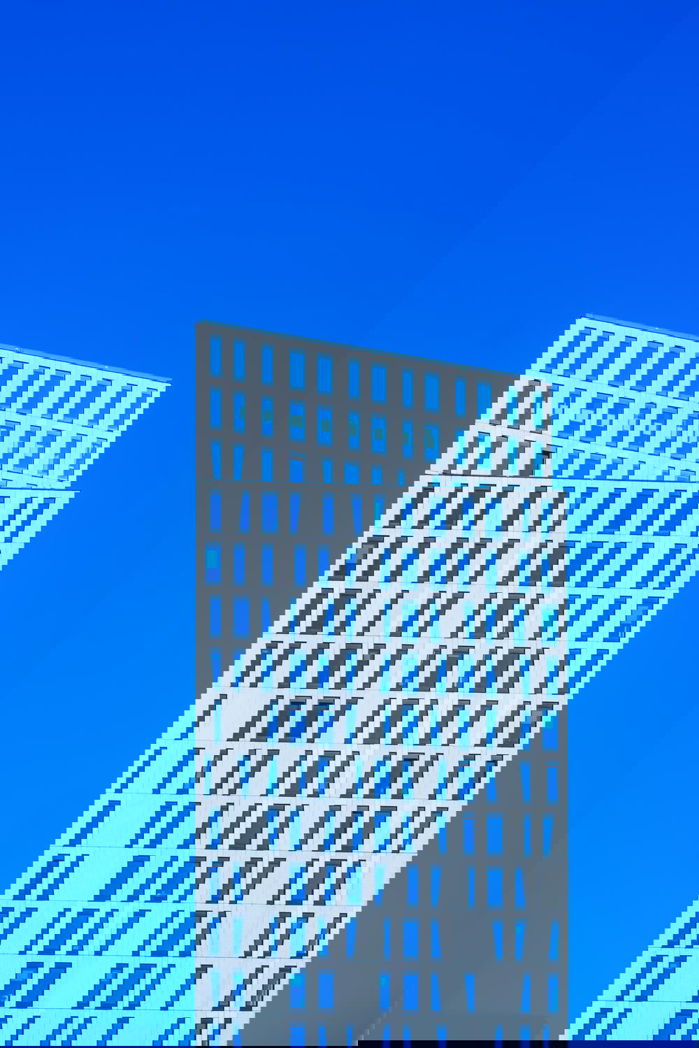 A white building showcasing architecture in Rotterdam, The Netherlands.