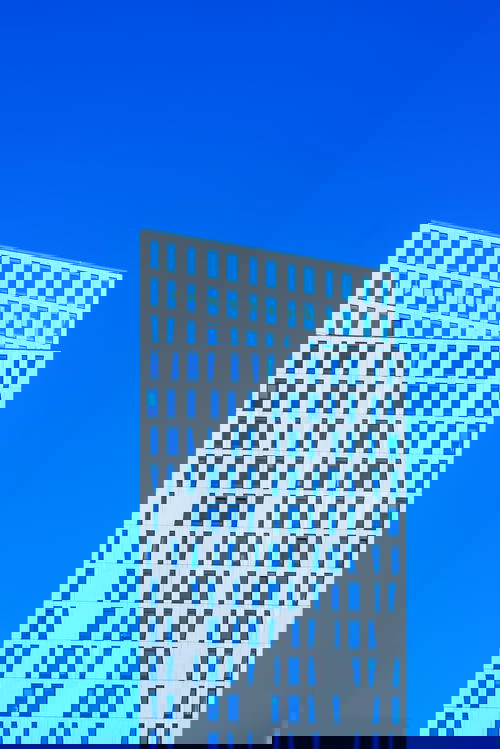 A white building showcasing architecture in Rotterdam, The Netherlands.