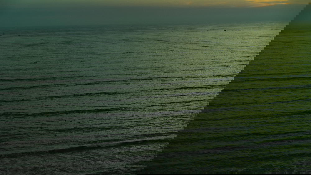 A man is riding a surfboard in Peru.