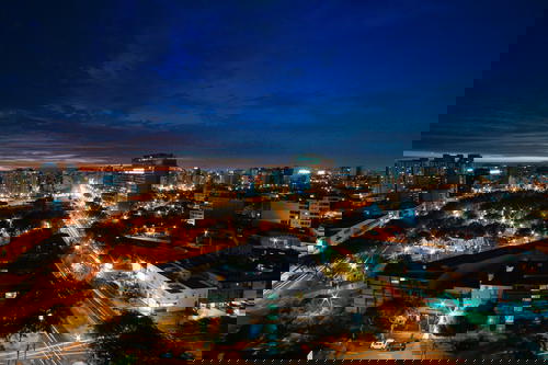 An aerial view of a city in Peru at night.