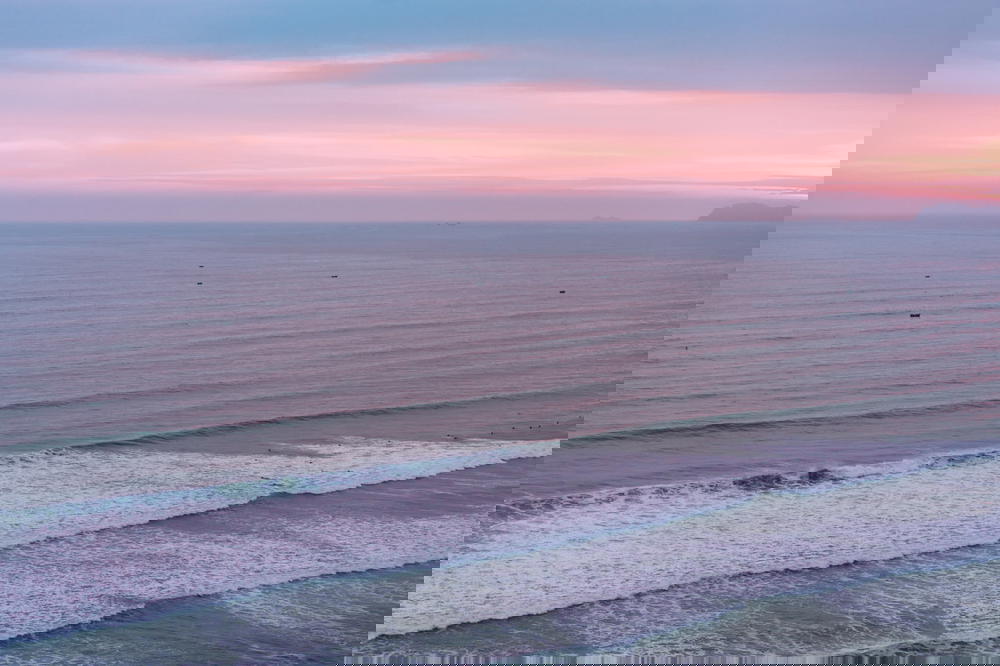 An aerial view of the ocean off the coast of Peru at sunset.