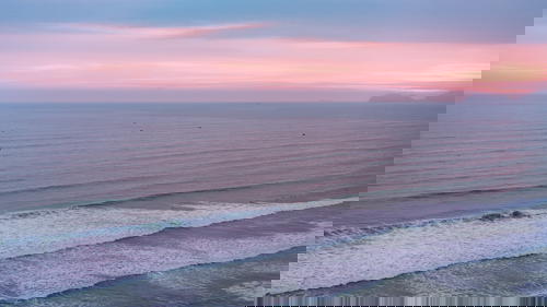 An aerial view of the ocean off the coast of Peru at sunset.