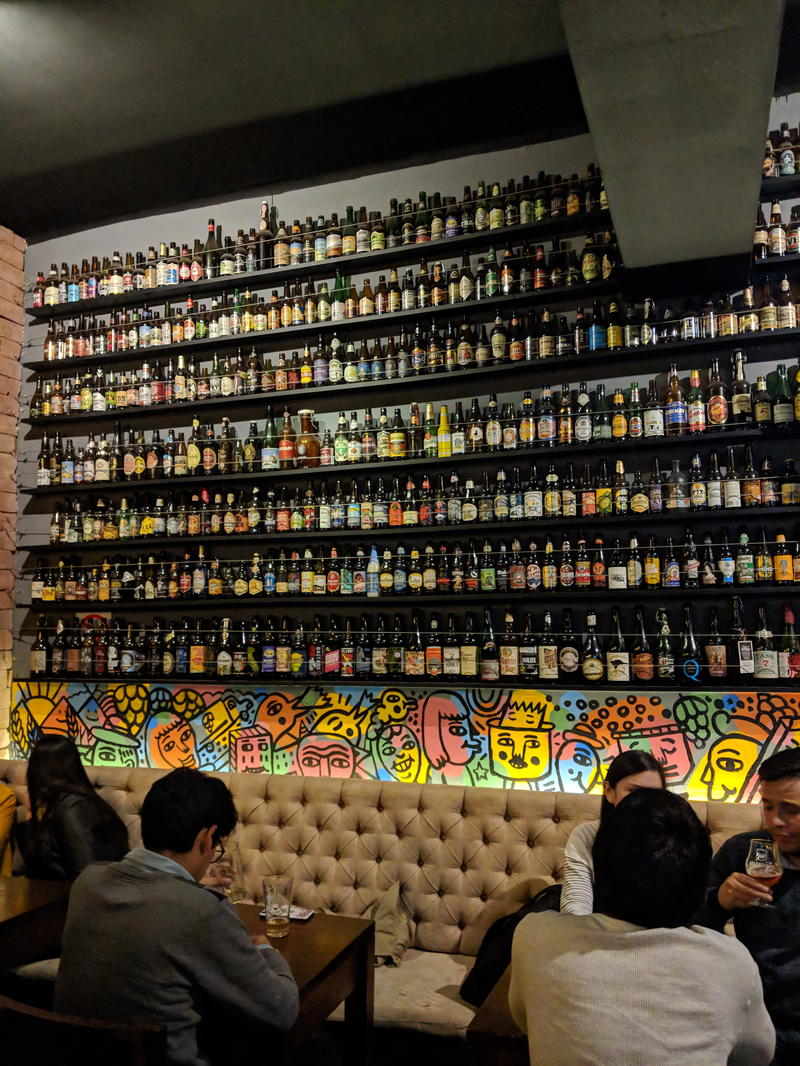 A group of people sitting at a bar in Lima, Peru.