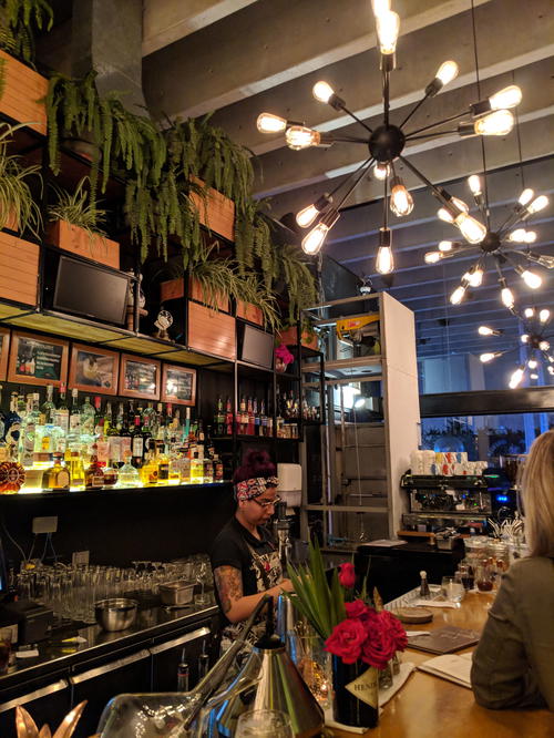 A woman sitting at a bar in Lima, Peru.