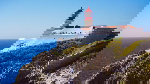 A Portugal lighthouse overlooking the ocean.