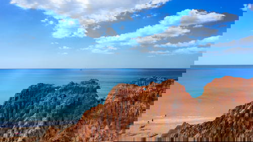 A rocky cliff overlooking the ocean in Portugal.