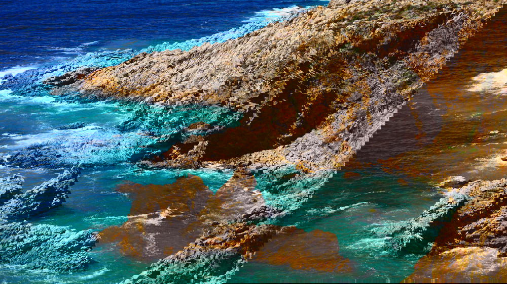 A rocky cliff overlooking the ocean in Portugal.