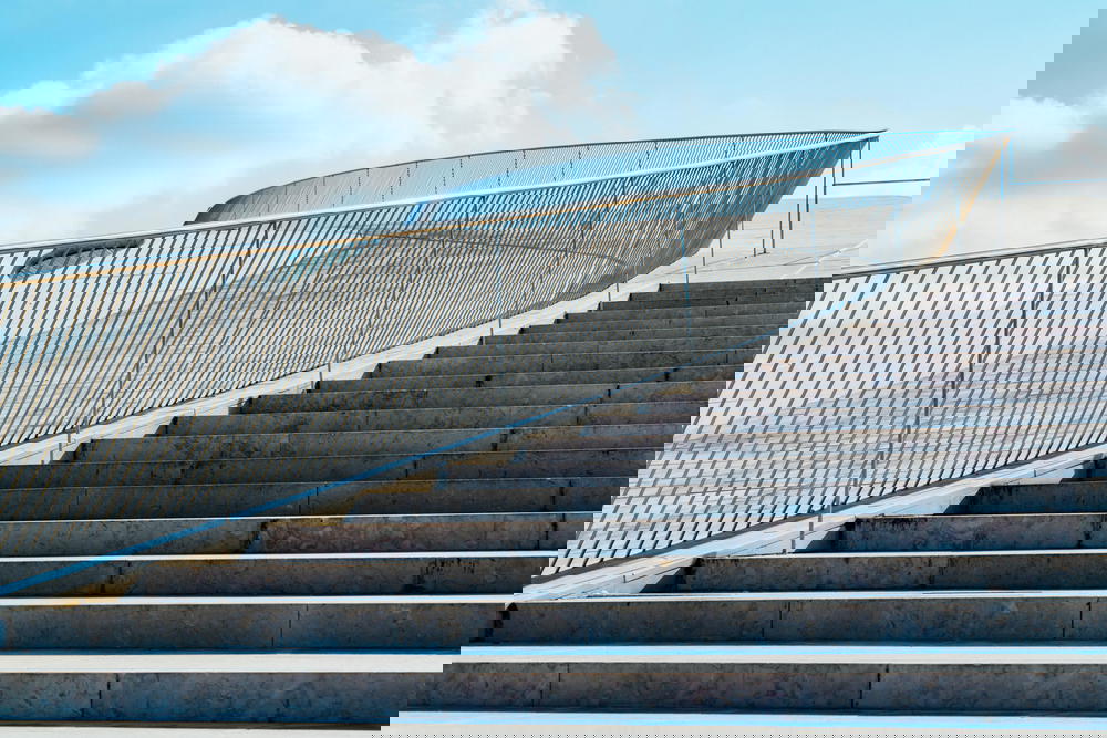 Steps leading up to the white waving walls of the maat