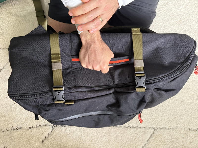 a man holding a roark travel bag