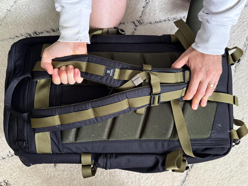 a person showing details of a roark travel bag
