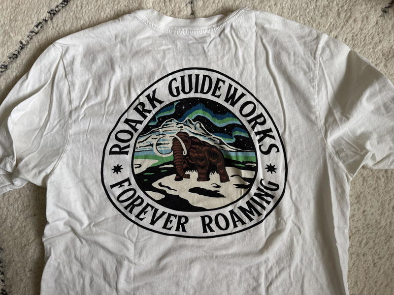 a white t-shirt with a roark logo on it