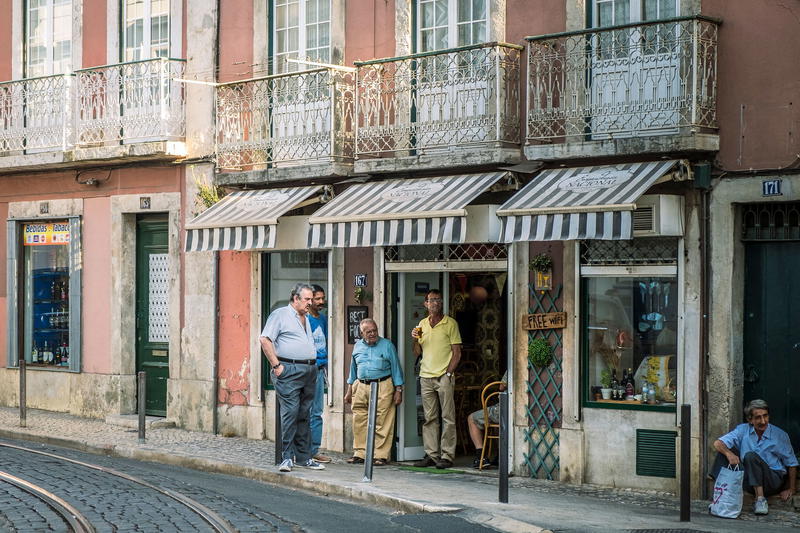 a group of people standing in front of a building