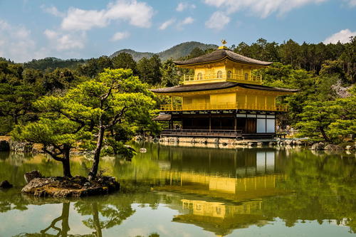 a large yellow building sitting on top of a lake