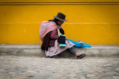 a woman sitting on the ground