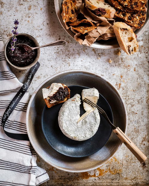 a plate of food on a table next to a bowl of food