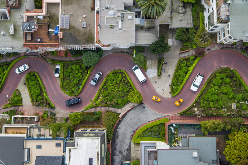 An aerial view of a curved road in san francisco, california.