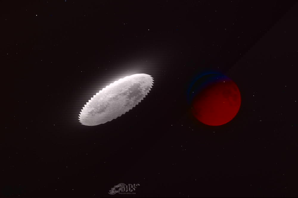 A blood moon is seen in the sky.