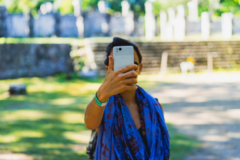 Woman holding a Google Pixel 2