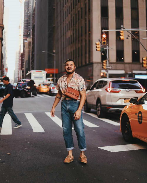 A man standing in the middle of a city street.