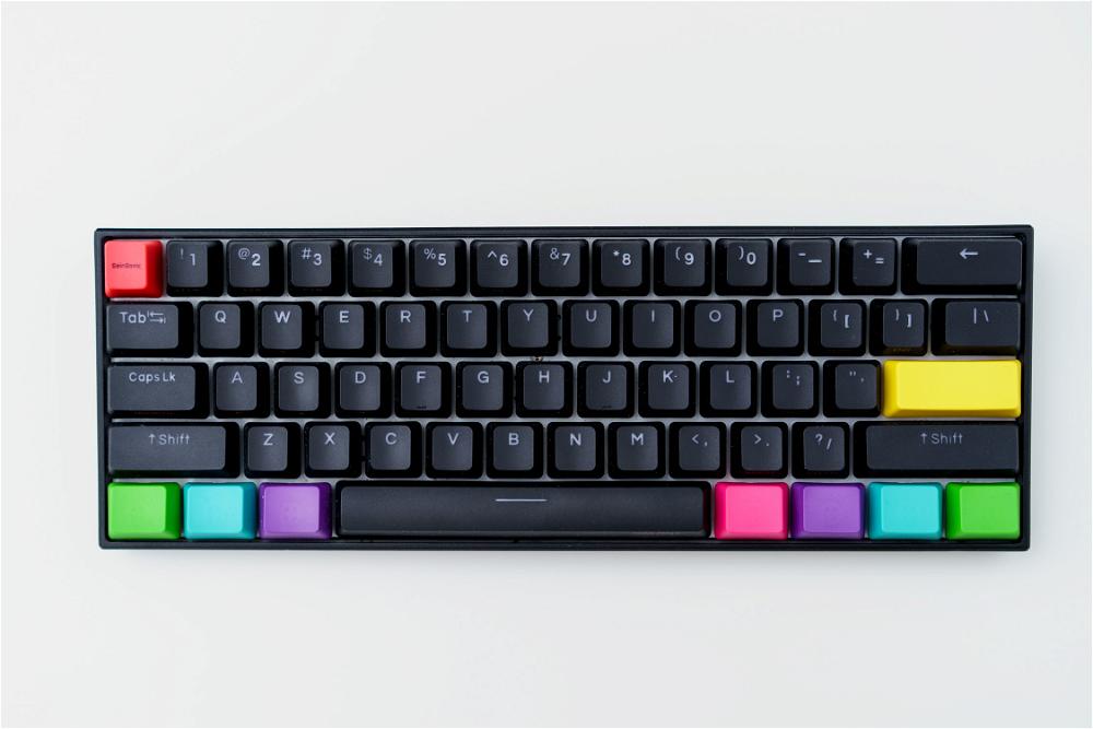 A black keyboard with colorful keys on a white background.