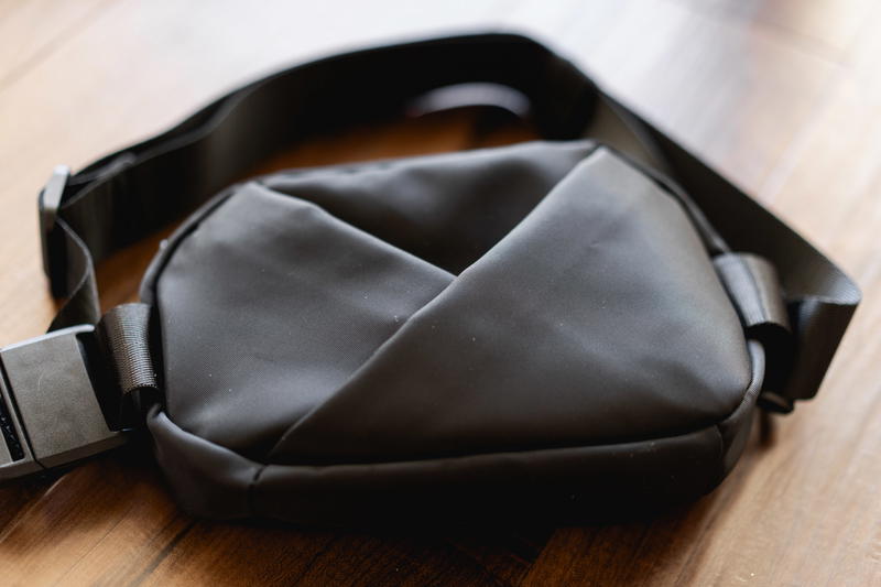 a black bag on a wooden floor