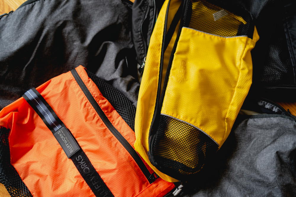 A flatlay image of a bunch of packing cubes.