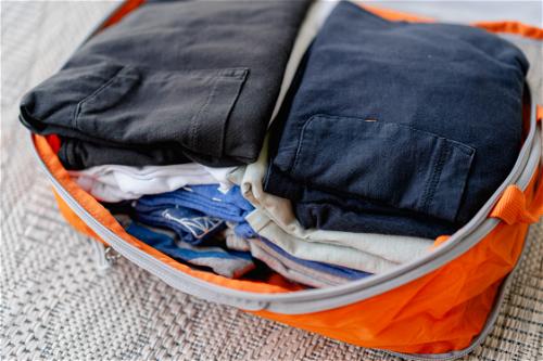 Clothes fitting inside the orange Bagsmart packing cube