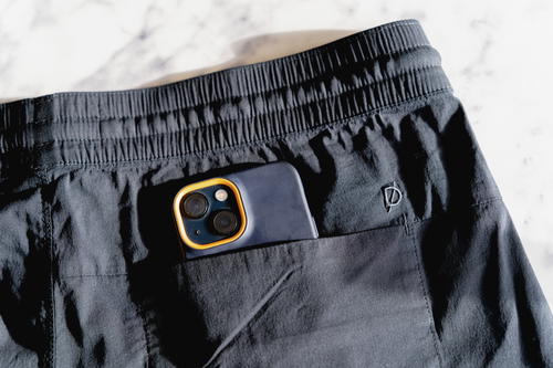 Phone in the back pocket of the DUER Weightless Poplin shorts
