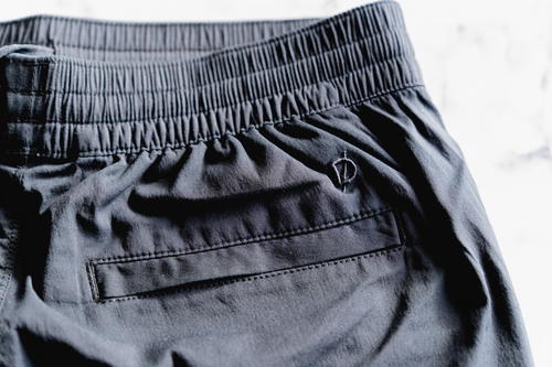 Logo and back pocket on the women's version of the DUER Weightless Poplin