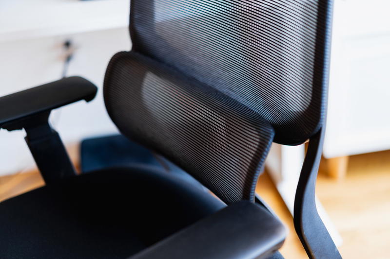 A close up of a black office chair.