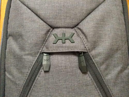 Front view of the double zipper accessories compartment on the gray Small Expandable Knack Pack