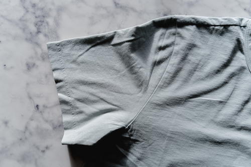 Close up of a light green Mott & Bow t-shirt