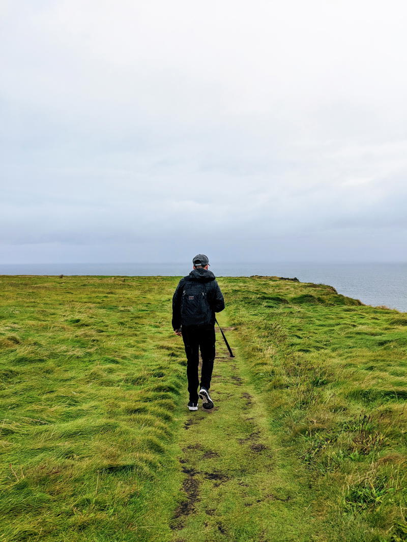 Man walking in ireland with DUER performance denim