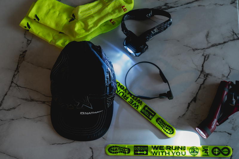 A hat, gloves, and other items are laid out on a marble table.