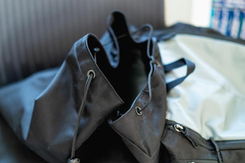 A black bag is sitting on top of a table.