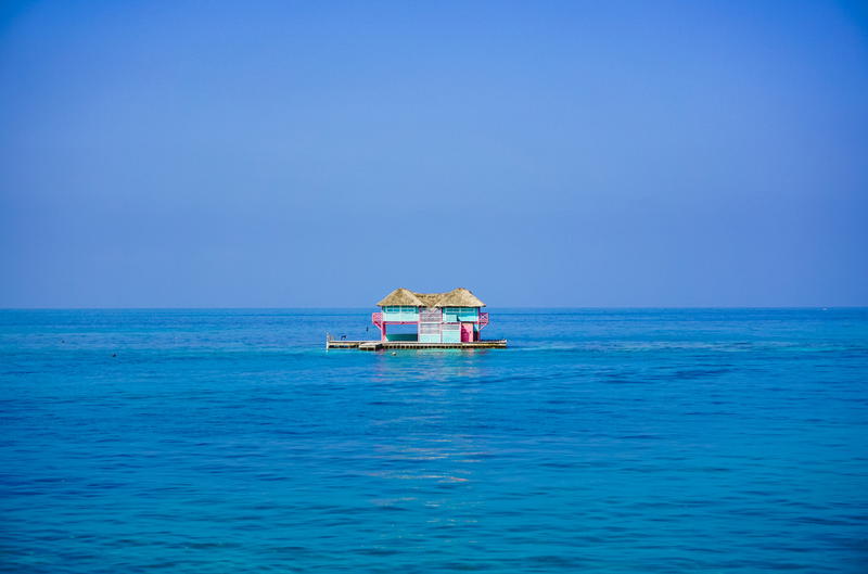 Blue and pink house in the water in Cartagena Colombia