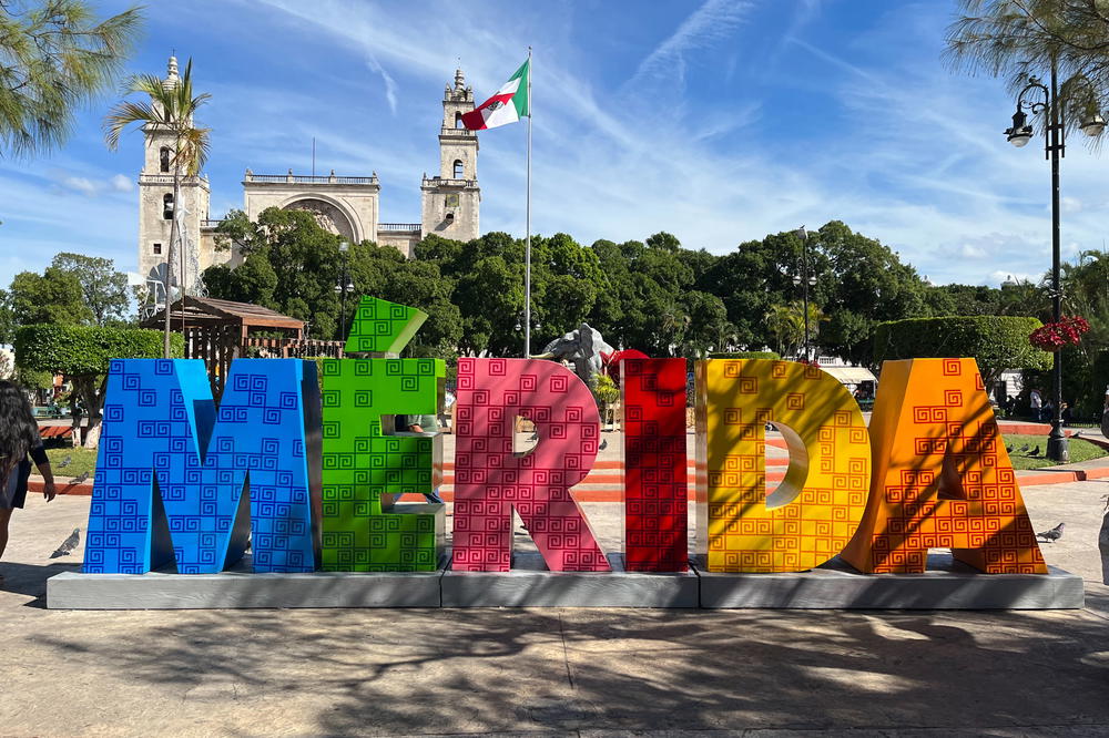 A colorful sign with the word Merida, representing a vibrant city in Mexico.