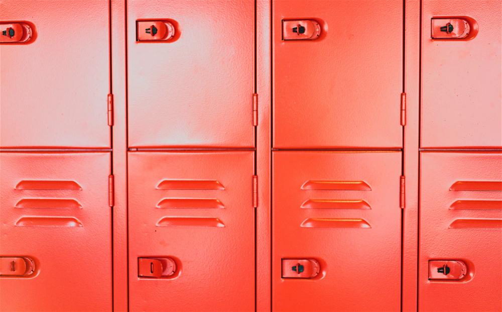 A row of red lockers on a white background.