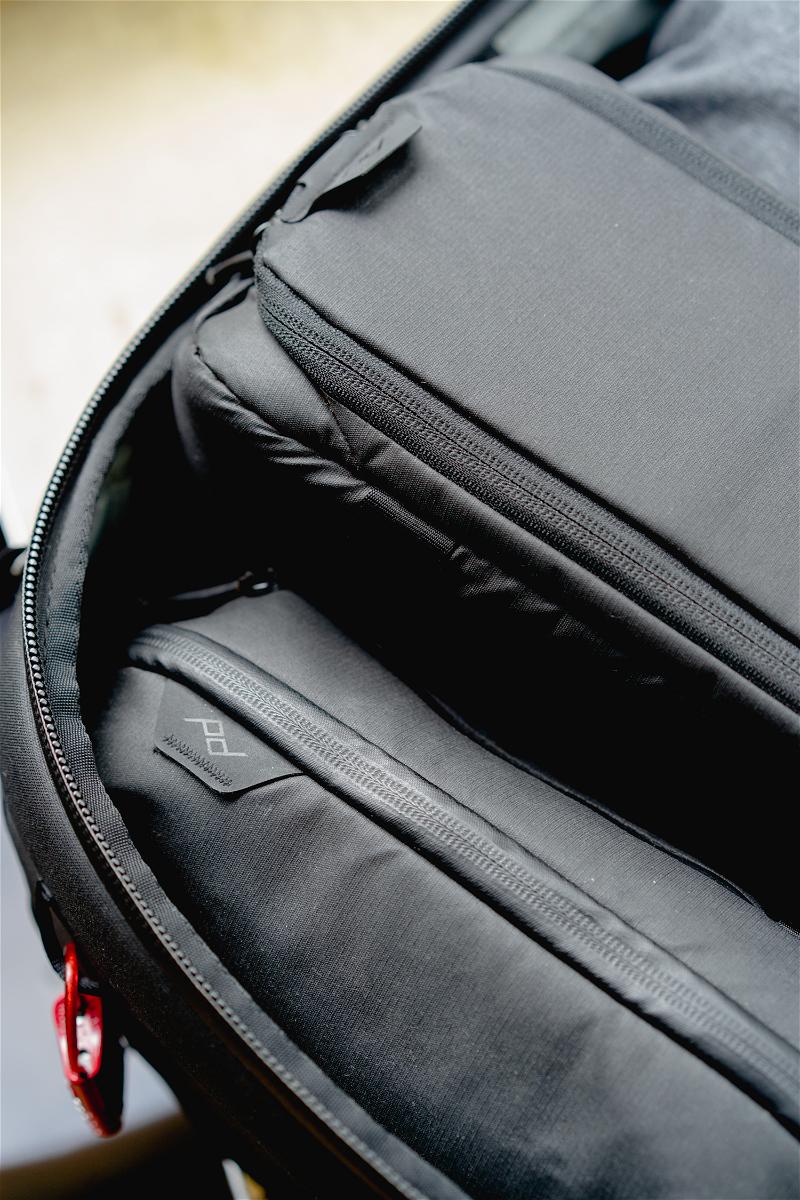 Inside the peak design travel backpack 45L where you can see the tech pouch and camera cube.