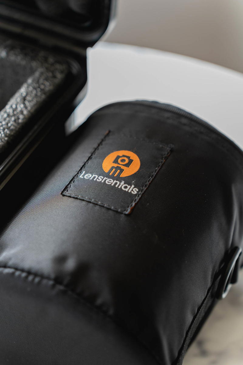 A black bag with an orange logo on it.