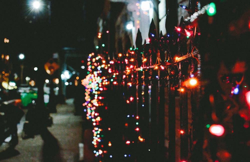 Christmas lights handing on a fence in New York City nyc how to get photos with bokeh