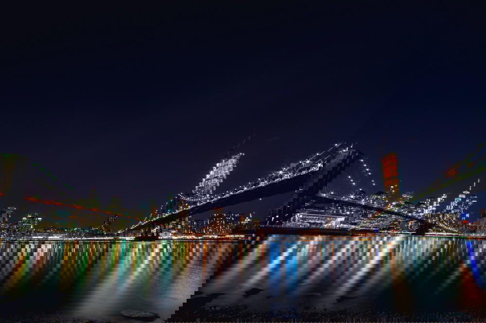 Reflection of New York City buildings from Brooklyn Bridge Park