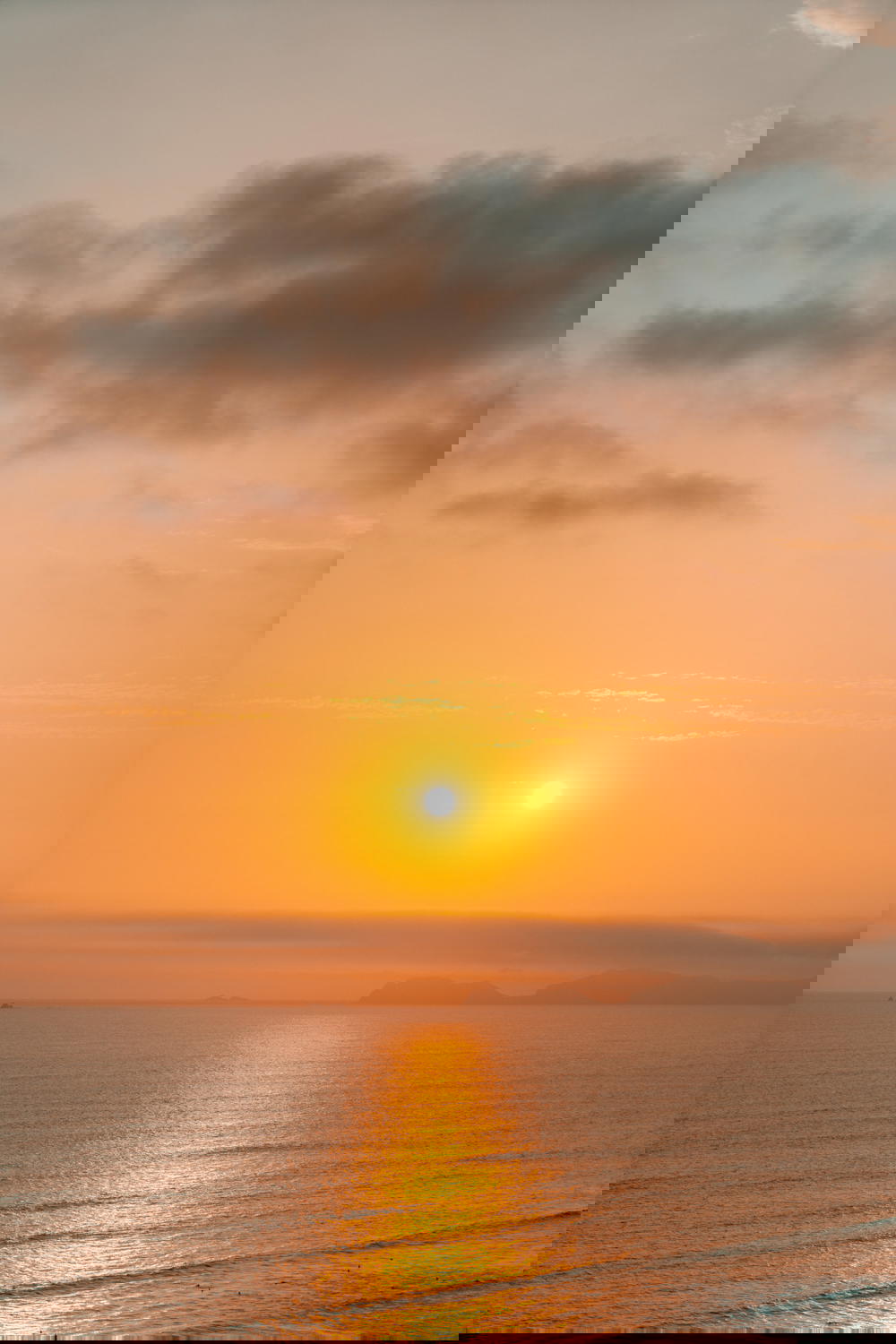 Bright yellow sunset on the water from Lima, Peru