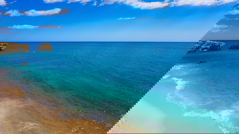 Bright blue water from a beach in Portugal