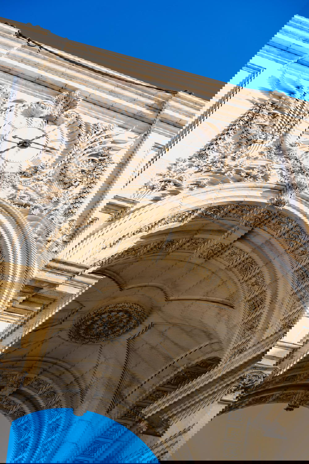 An archway with a clock on it.