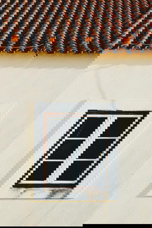 A window with a tiled roof.